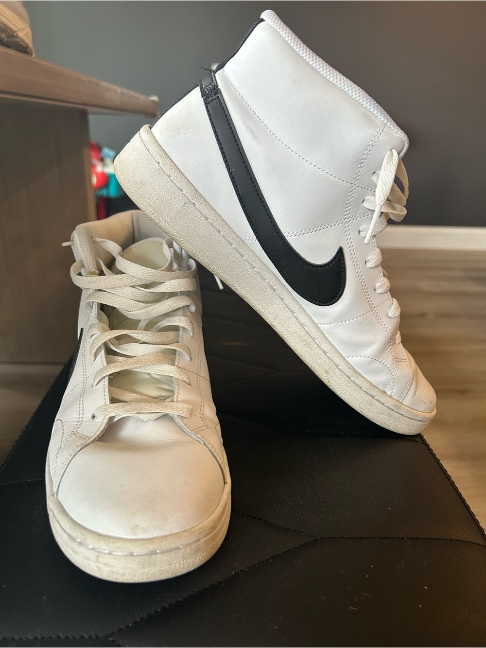 Nike White High-Top Sneakers with Black Swoosh